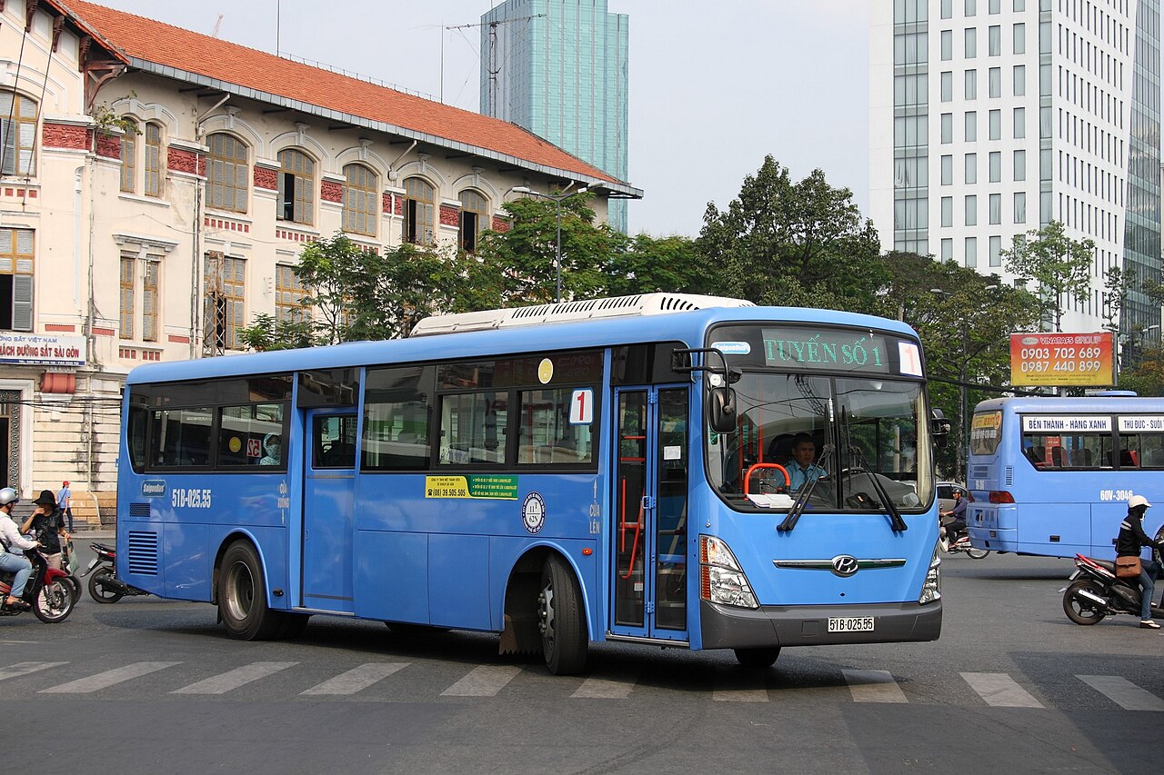 A blue Route 1 city bus on a Ho Chi Minh City street in a 2013 photograph; archival illustration only, not a current validation device or proof of route eligibility.