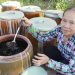 Bay Muon with her urns of fish sauce in Can Tho City, Vietnam. Photo: Chi Cong / Tuoi Tre