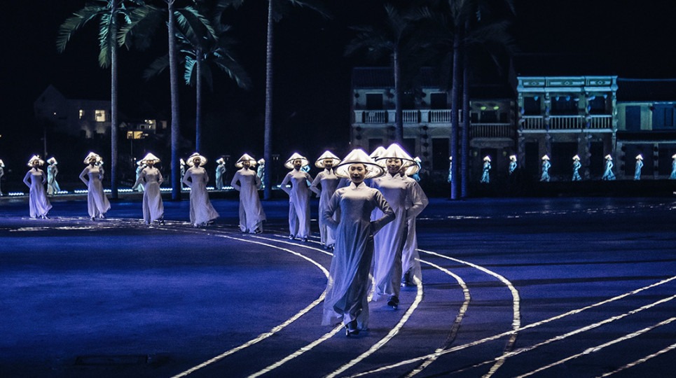 The image of young women wearing ao dai and conical hats appeared throughout the performance
